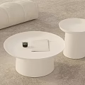 Modern White Round Coffee Table With Beige Sofa Side Table Green Cup And Notebook 3d model