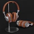 Brown Leather Headphones With Silver Metal Accents On Stand And Placed