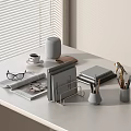 Gray Notebook On Office Desk With Coffee Cup Newspaper Glasses And Stationery Items