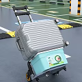 Silver Suitcase Placed On Blue Box With Luggage Cart At Airport Floor