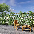 Lush Gourd Vine Covered Trellis Fence In Courtyard With Wooden Chairs And Table
