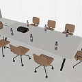 Modern White Conference Table With Brown Rolling Chairs And Water Bottles In Meeting Room