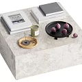 Modern Coffee Table with Stacked Books Magazine Green Candle Black Tray and Purple Decorative Balls