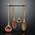 Four Decorative Wooden Spoons Hanging On Wall Mounted Rack For Kitchen Utensil Storage And