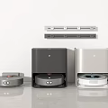 Robot Vacuum Cleaners With Charging Docks In Gray Black Silver On White Wall Gray Countertop