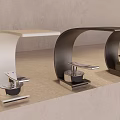 Multiple Modern Faucets In Various Colors And Designs On Light Countertop With Gray Wall