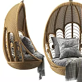 Wicker Hanging Chair With Intricate Pattern Cozy Pillows And Plaid Blanket For Home Interior