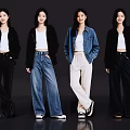 Four Women Posing In Stylish Outfits With White Tops And Different Bottoms On Dark Background