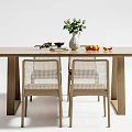 Light Wood Dining Table Set With Rattan Back Chairs Brown Cushions And Decorative Vase