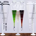 Transparent Conical Glass Containers With Green Red Liquids And White Structures