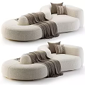 Bouclé Fabric Beige Curved Sectional Sofa With Brown Throw Blanket And Decorative Pillows