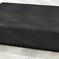 Sleek Modern Television With Blue Wave Mountain Scene On Concrete Stand
