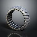 Futuristic Tire Design With Geometric Block Pattern And Silver Metallic Finish