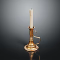 Gold Candle Lamp With White Candle Curved Handle And Round Base On Dark Background