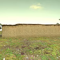 Traditional Adobe House With Thatched Roof Two Doors Several Windows And Trees On Grassland
