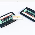 Super Tape Audio Cassettes In Black Cases Displayed On White Background 3d model