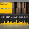 Trip.com Group Background Wall With Yellow Design Text Elements City Skyline Silhouette And Brand Logo