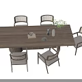 Elegant Wooden Tea Table and Rattan Backrest Padded Chairs with Green Plant Fruit Plate