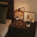 Wooden Bedside Table With Modern Lamp Astronaut Figurine Framed Art And White Vase In Bedroom