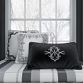 Black and White Decorative Throw Pillows with Intricate Patterns by Window with Snowy View