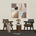 Modern Table and Chair Set with Woven Armchairs Blanket Wall Paintings Natural Light