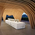 Curved Wooden Pergola Outdoor Setting With White Long Table And Floral Arrangements