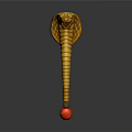 Golden Cobra With Striped Body Flattened Head And Red Ball Base On Dark Background