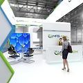 QMF.COM Modern Exhibition Booth With Blue Green Hexagonal Design Display Screens And Professional Staff Interaction
