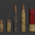 Assorted Bullet Sizes In Metallic And Red Casings On Dark Surface