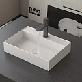 Modern White Square Washbasin With Gray Faucet On Dark Countertop And Decorative Painting