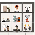 Decorative Dolls Displayed On White Shelves With Various Designs Small Ornaments And Books