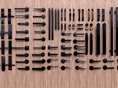 Various Black Metal Door Handles Displayed on Wooden Surface with Assorted Styles 3d model
