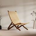 Natural Rattan Leisure Chair With Wooden Frame And Dried Branch Decor In Minimalist Setting