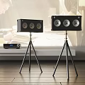 Black Speakers With Multiple Drivers On Tripods And Amplifier In Modern Room
