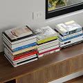 Stacked Books With Various Colors On Wooden Shelf Near Window And White Wall