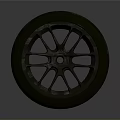 Black Car Tire With Stylish Alloy Wheel Rim And Tread Pattern