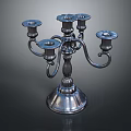 Elegant Silver Metal Candelabra With Multiple Arms And Ornate Round Base