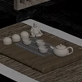 Traditional Tea Tray Setup With Teapot Teacups And Buddha Statue On Mat 3d model