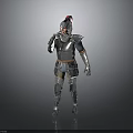 Man In Medieval Full Body Armor With Red Helmet Standing Against Gray Background