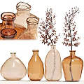 Transparent And Colored Glass Vases With Decorative Floral Branches In Various Shapes