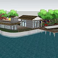 Scenic Waterfront Building Area With Green Trees Roads And Parked Cars
