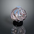 Stylish Modern Electronic Appliance Featuring Silver Spiral Design And Black Base