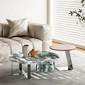 Modern Round Coffee Table With Marble Top Metal Frame And Decorative Vases In Living Room
