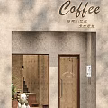 Minimalist Cafe Exterior Design With Wooden Door Concrete Wall Signboard And Green Plant