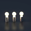 Three Glowing Light Bulbs With Silver Bases And Warm Light Reflections On Dark Background