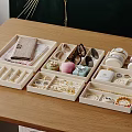 Neatly Arranged Jewelry Storage Boxes With Compartments For Rings Earrings Necklaces And Watches