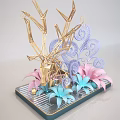 Handcrafted Decorative Sculpture With Golden Geometric Structure And Colorful Paper Flowers On Black Striped Tray
