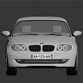 White BMW Hatchback Car With Sleek Design And Alloy Wheels On Reflective Surface