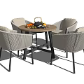 Modern Outdoor Table with Four Woven Chairs and Fruits Tea Set on Top