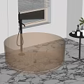 Transparent Amber Round Bathtub By Window With Marble Floor And Side Table Plant Candles